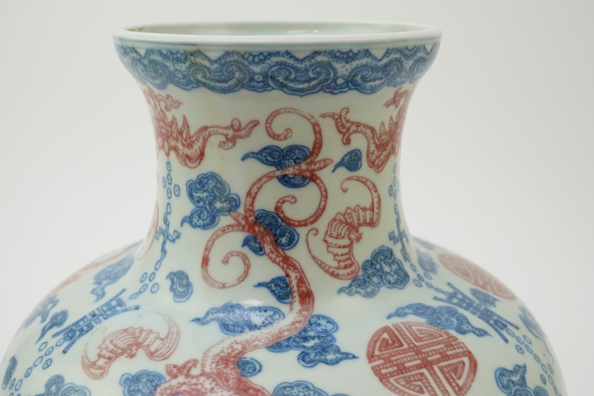 A Chinese underglaze blue and copper red ‘dragon’ vase, Qianlong seal mark but early 20th century